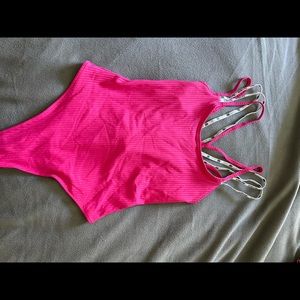 Pink. One piece bathing suit. Brand new. Never worn. Size L